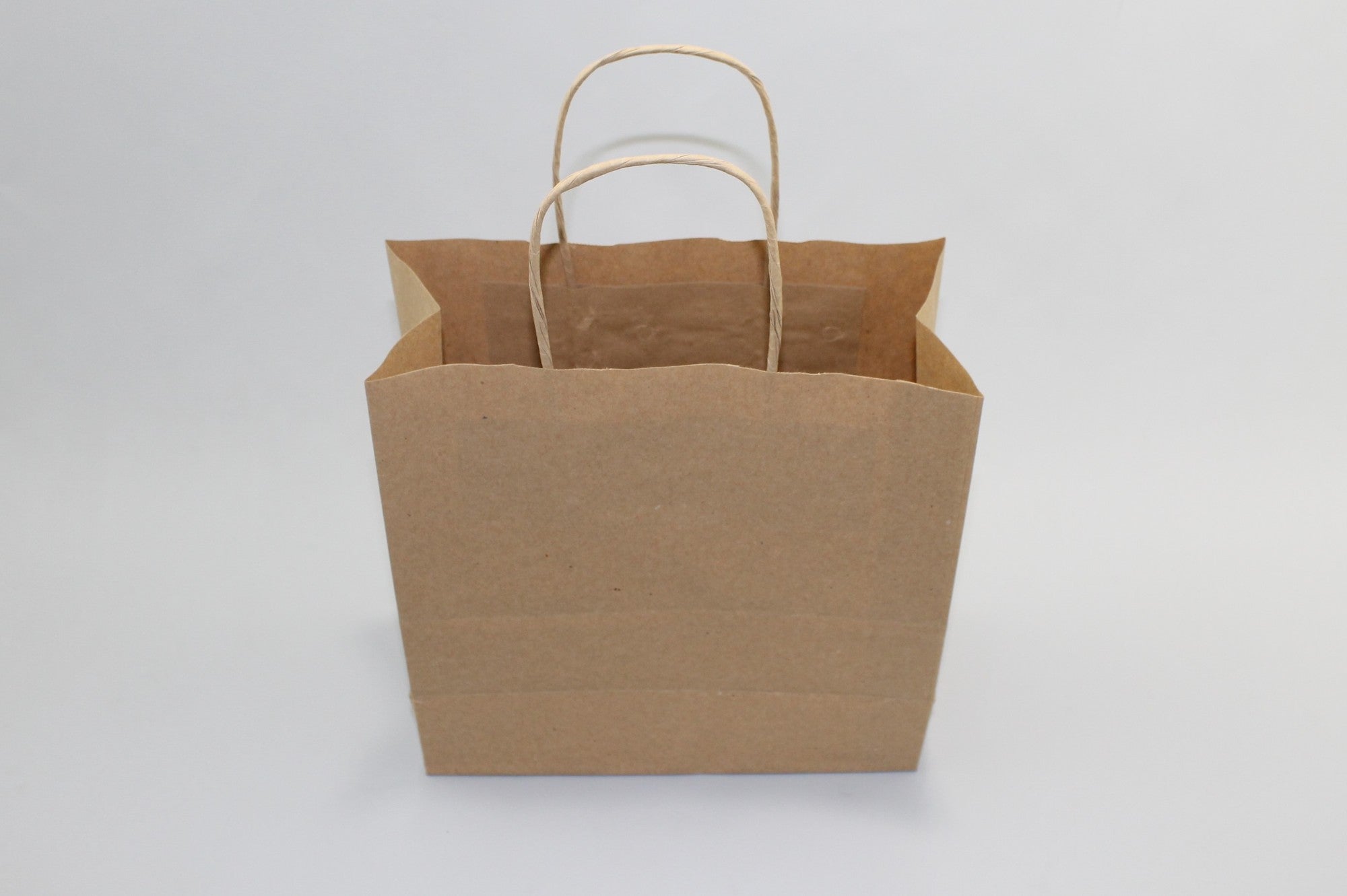 Paper Carrier Bags Brown 22x10x28cm Kraft 90 grams with twisted handles (50 pieces) [PAMB2231]